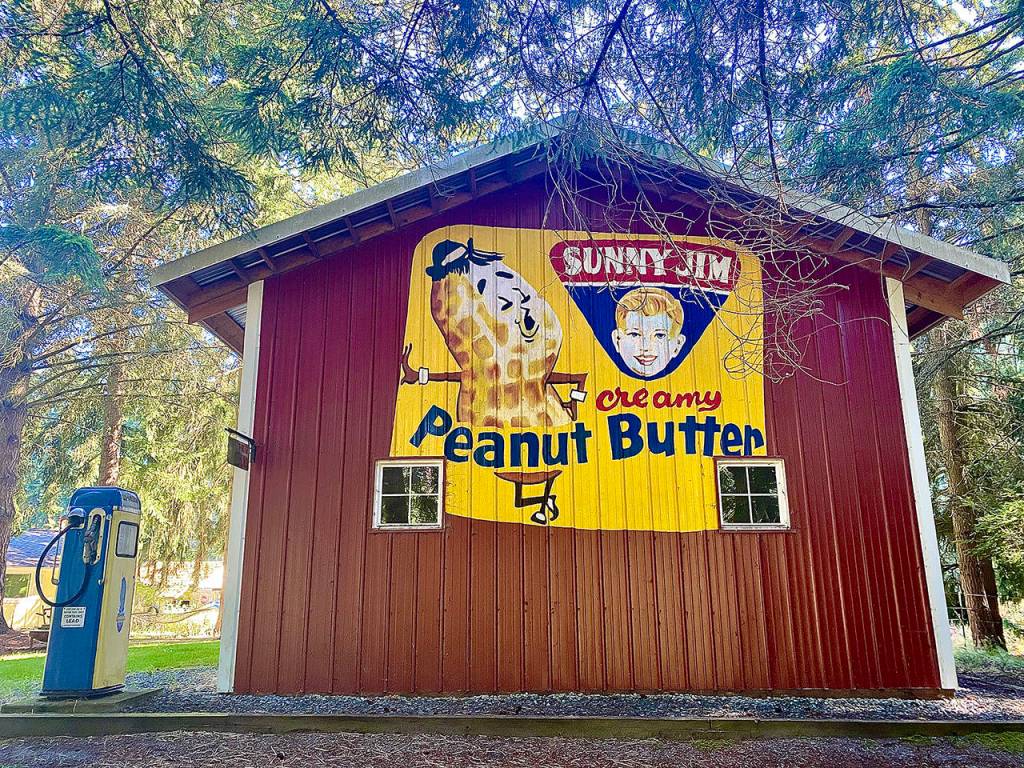 Don Rockwell with the help of his son, Dennis, painted a Sunny Jim Peanut Butter mural on a barn in Clinton on Whidbey Island about five years ago. (Andrea Brown / The Herald)
