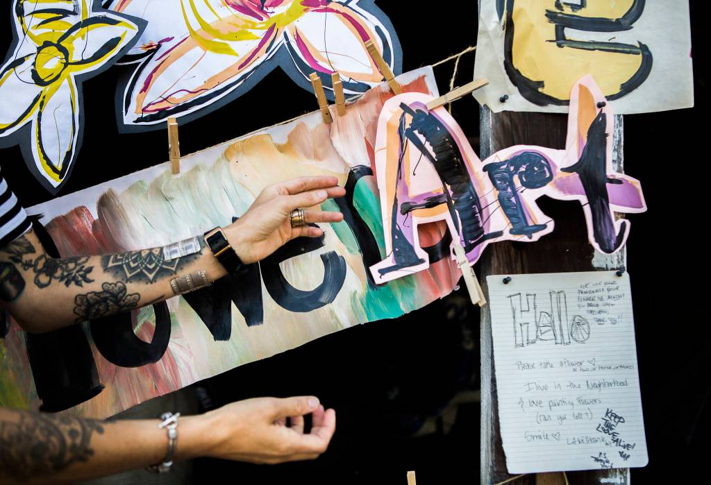 Passersby have posted notes of thanks on Lennon Wiltbanks art project in Bothell. (Olivia Vanni / The Herald)