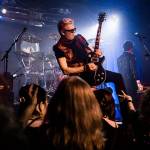 Dave Dodge stands on a speaker while playing his guitar during Nite Waves show at Tony Vs Garage on Saturday, June 8, 2019 in Everett, Wash. (Olivia Vanni / The Herald)