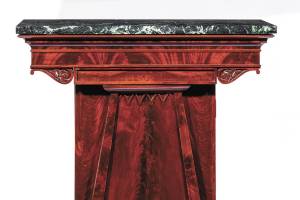 This is an antique mixing table that is 40 inches high and 36 inches wide. It is used to store liquor, mix drinks and become a serving table in a dining room. It sold for about $3,000. (Cowles Syndicate Inc.)