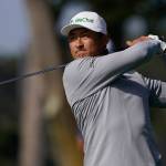 Li Haotong hits from the fairway on the 10th hole during the second round of the PGA Championship on Aug. 7, 2020, at TPC Harding Park Friday in San Francisco. (AP Photo/Charlie Riedel)