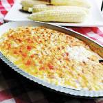 Kansas City cheesy corn is hearty and decadent, with two kinds of cheese and two kinds of pork. (Gretchen McKay / Post-Gazette)