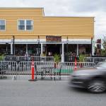 Cars drive by the streatery area outside of Cafe Zippy along Rucker Avenue on Thursday in Everett. (Olivia Vanni / The Herald)