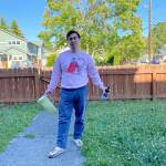 Ben greets us wearing a pink sweatshirt with the logo of his favorite girl band. (Sue Misao / The Herald)