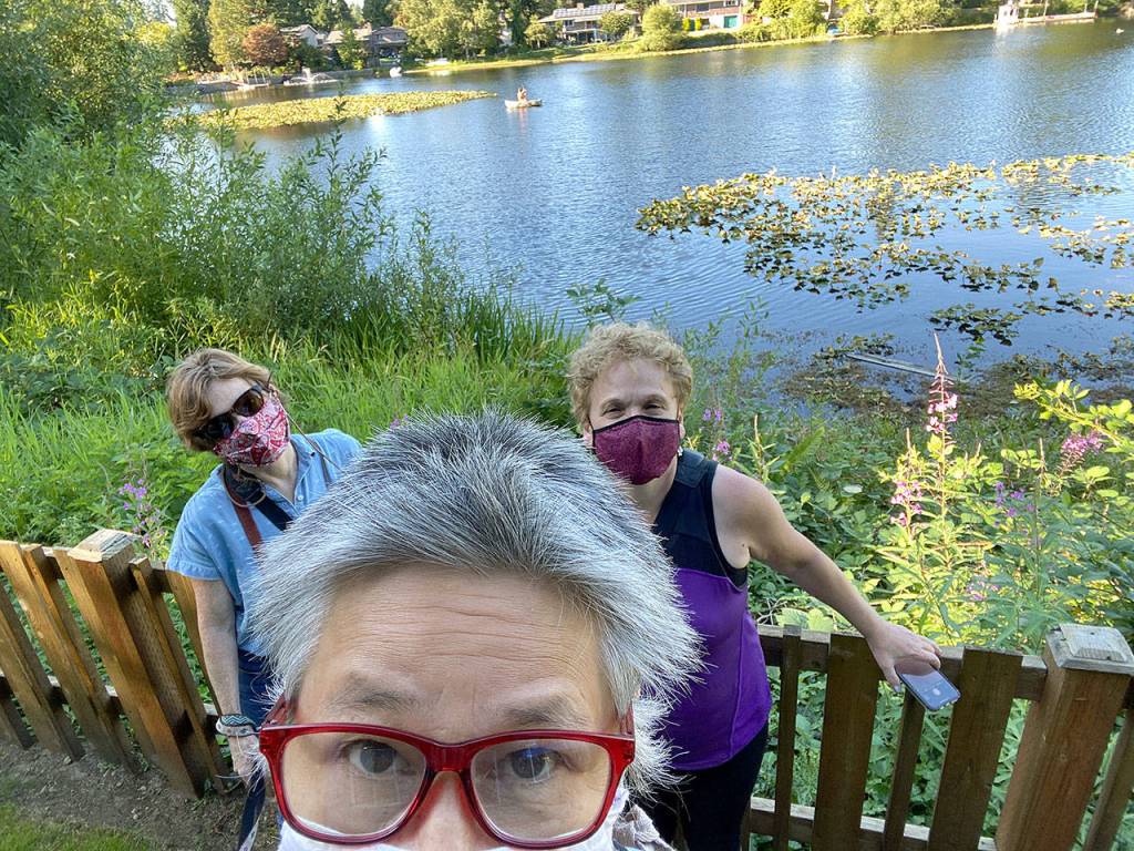 From left, Janice Podsada, Sue Misao and Andrea Brown at Beverly Lake in Everett. (Sue Misao / The Herald)