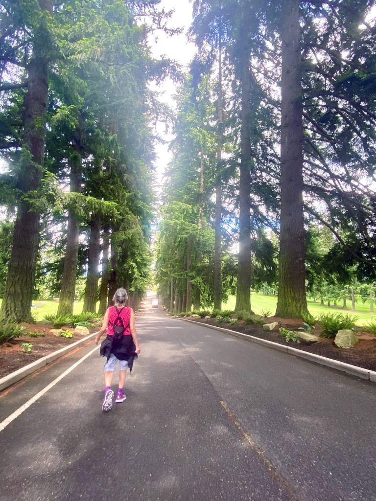 Sue leads the way through the Everett Golf & Country Club. (Andrea Brown / The Herald)