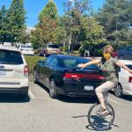 Janice rides her unicycle in the Herald parking lot. (Andrea Brown / The Herald)