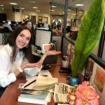 Herald reporter Julia-Grace Sanders appears to appreciate the gift of a giant leaf in 2019. (Andrea Brown / The Herald)