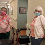 Gail and Alice chat in the hallway at Windsor Square.