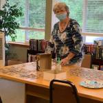 Claudia working on a puzzle in the Windsor Square Library