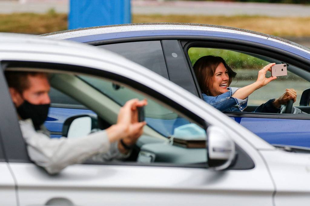 Friends and family watch as Washington State University medical students are honored. (Kevin Clark / The Herald)