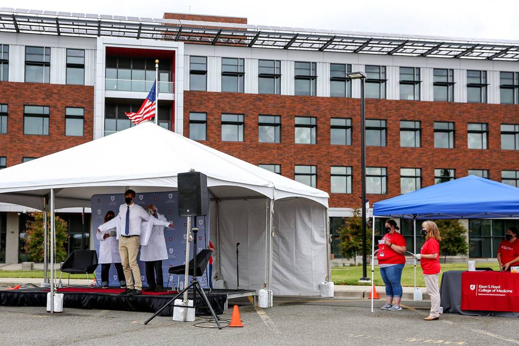 Conner Cleary has his white coat adorned. (Kevin Clark / The Herald)