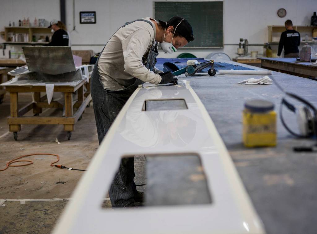 Pocock Racing Shells in Everett depends on college football programs, which are major sources of revenue for less-lucrative sports like rowing. (Olivia Vanni / The Herald)