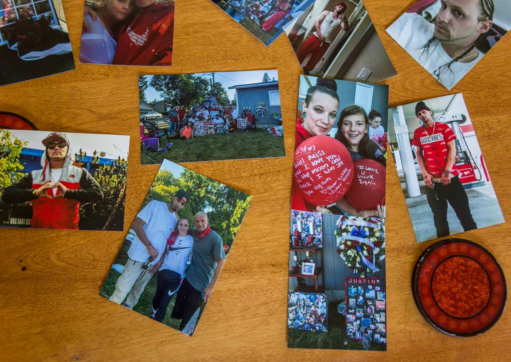 Photos of Justin Murphy, who died Aug. 4, along with pictures of friends and family at his Aug. 15 memorial in Everett. (Olivia Vanni / The Herald)