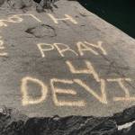 Pray for Devin is spray-painted on rocks near Eagle Falls.