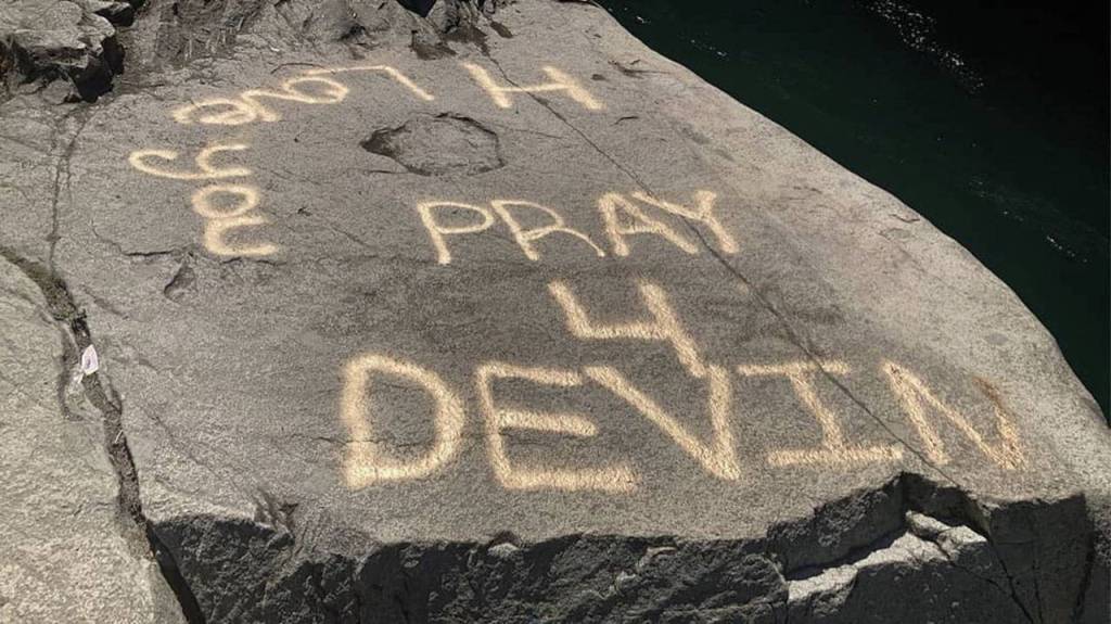 Pray for Devin is spray-painted on rocks near Eagle Falls.