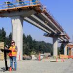 Sound Transit construction manager Ginger Ferguson talks to reporters on Wednesday at a construction site for the 130th Street station in Seattle, part of the light rail extension to Lynnwood. (Joey Thompson / The Herald)