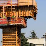 Construction workers make progress on a column for the light rail extension to Lynnwood on Wednesday. (Joey Thompson / The Herald)