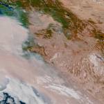 Smoke has inundated the West Coast and was forecast to move north to the Puget Sound region. This view from a weather satellite was taken Thursday afternoon. (National Oceanic and Atmospheric Administration)