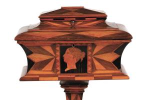 Tea, an expensive luxury in the 18th century, was kept in a locked box. This tea caddy on a pedestal is 33 inches high by 16 inches wide. It auctioned for almost $3,000. (Cowles Syndicate Inc.)