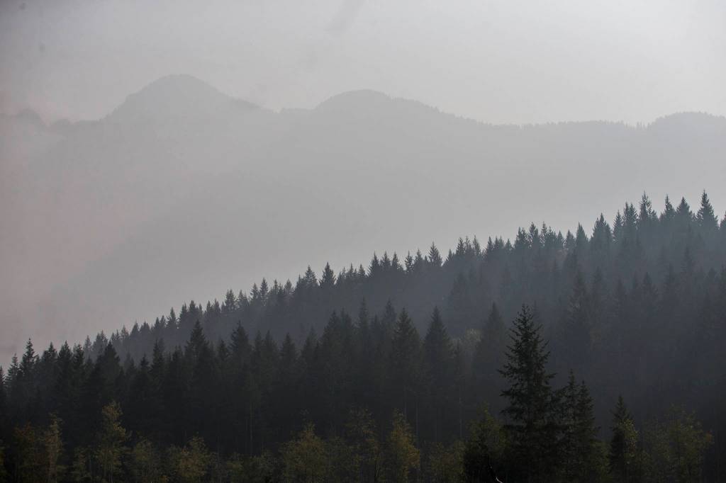 The ridge line of Jumbo Mountain is barely visible through the wildfire smoke on Friday, Sept. 11, 2020 in Darrington, Wa. (Olivia Vanni / The Herald)