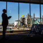 A man waits to board his flight at Paine Field on Monday, March 4, 2019 in Everett, Wa. (Olivia Vanni / The Herald)