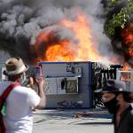 Construction buildings burn near the King County Juvenile Detention Center on July 25 in Seattle. (AP Photo/Ted S. Warren, file)