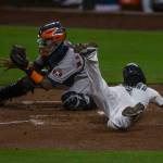 The Mariners J.P. Crawford slides into home plate to score during a game against the Astros on Wednesday, Sept. 23, 2020, in Seattle. (Olivia Vanni / The Herald)