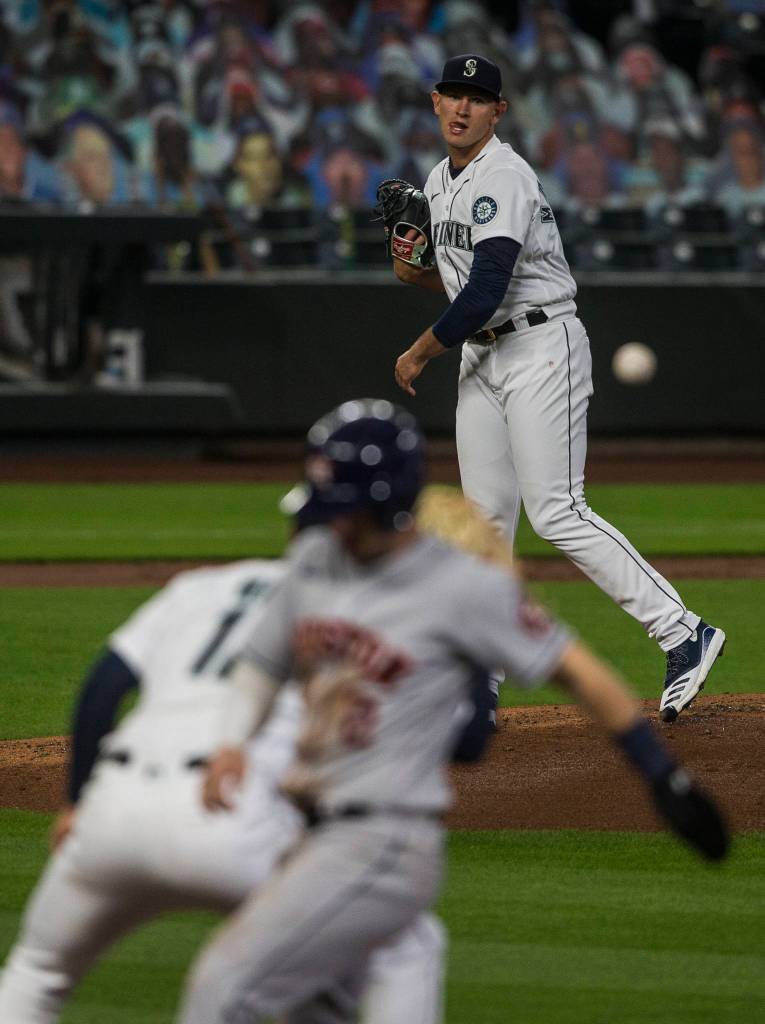 Mariners pitcher Nick Margevicius tries to throw the Astros Alex Bregman out at first during a game on Wednesday, Sept. 23, 2020, in Seattle. (Olivia Vanni / The Herald)