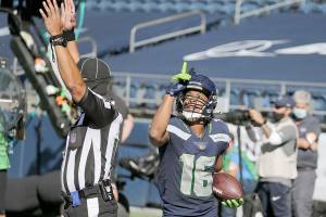 Seattle Seahawks wide receiver Tyler Lockett reacts after scoring a touchdown against the Dallas Cowboys on Sept. 27. (John Froschauer / Associated Press)