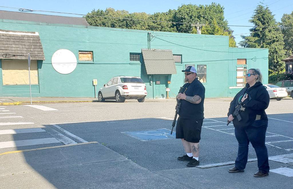 Armed citizens stand vigil in Snohomish on June 1. (Ian Davis-Leonard / The Herald)