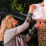 Caroline Petry collects her food the food truck stop on Beverly Blvd. in Everett on October 1, 2020. (Kevin Clark / The Herald)