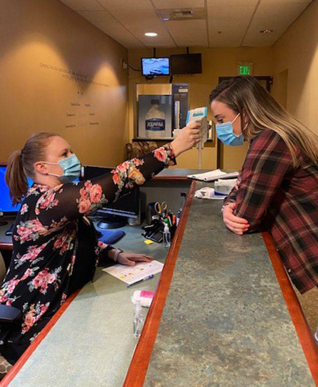 Dispatchers are screened for fever before starting their shifts at Snohomish County 911, due to the COVID-19 pandemic. (Courtesy of Snohomish County 911)