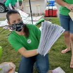 Stephanie Jerdon with A Voice for Washington Children holds a stack of signed petitions for Referendum 90 at the groups celebration in the Spokane Valley on June 2. (A Voice for Washington Children)