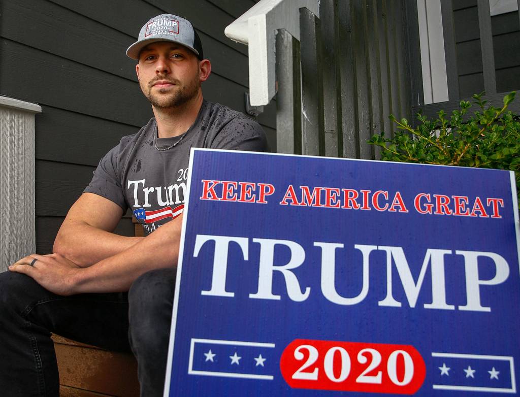 Jesse Bowers, 27, of Snohomish supports Donald Trump and says he gets dirty looks when he wears his Trump hat. (Kevin Clark / The Herald)