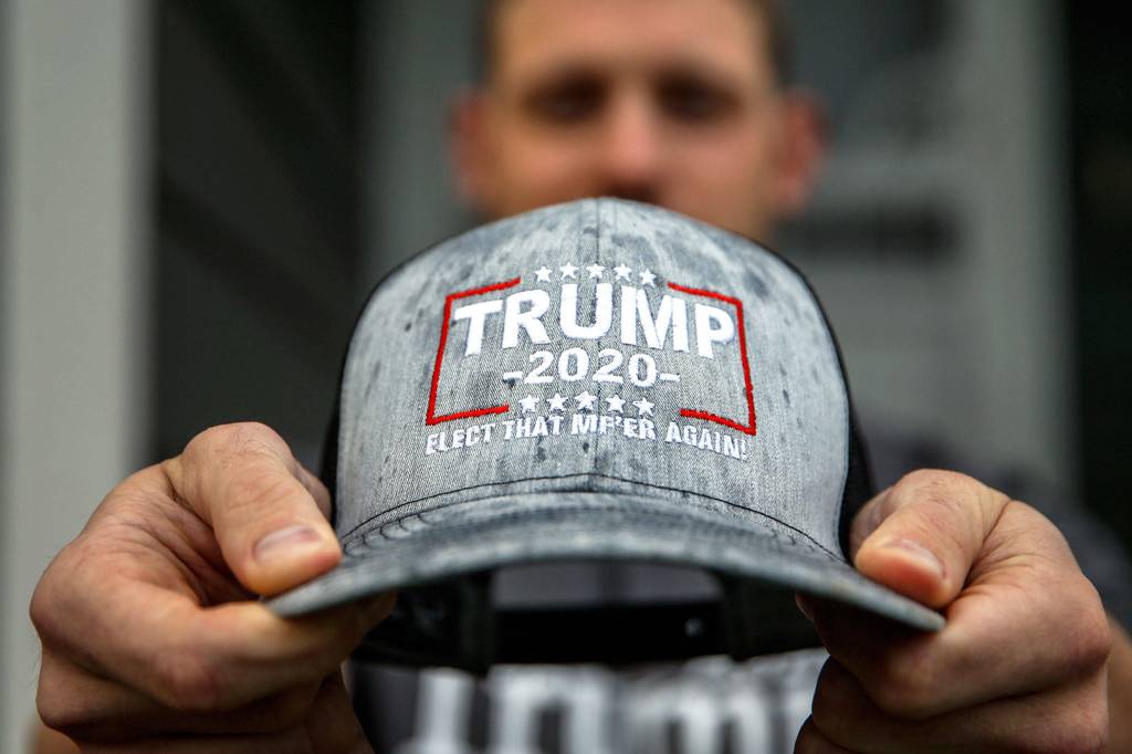 Jesse Bowers, 27, of Snohomish supports Trump and says he gets dirty looks when he wears his Trump hat. (Kevin Clark / The Herald)