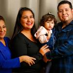 From left, Guillermina Victoria, Jessica Figueroa, Leilani Flores and Rafael Flores at their home in Marysville. Figueroa, 27, is voting in her first election and says she is casting a vote that is the voice of her household. (Kevin Clark / The Herald)