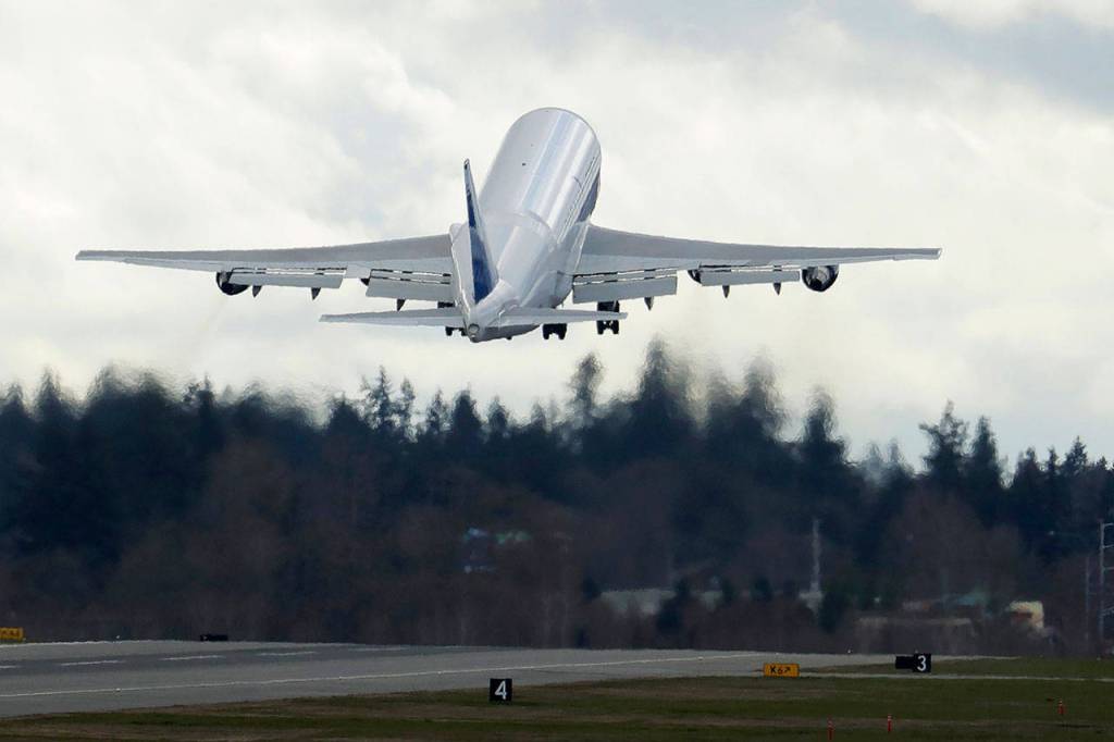 A Boeing Dreamlifter airplane takes off from Paine Field near Boeings manufacturing facility in Everett on March 23. (AP Photo/Ted S. Warren, file)