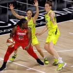 Storm guard Sue Bird (10) and forward Breanna Stewart (30) defend Dream forward Shekinna Stricklen during the first half of a WNBA game Aug. 12, 2020, in Bradenton, Fla. (AP Photo/Chris OMeara)