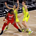 Atlanta Dream forward Shekinna Stricklen (40) dribbles in front of Seattle Storm guard Sue Bird (10) and forward Breanna Stewart (30) during the first half of a WNBA basketball game Wednesday, Aug. 12, 2020, in Bradenton, Fla. (AP Photo/Chris O'Meara)