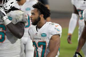 Miami Dolphins running back Myles Gaskin (37) walks to the locker room after the first half of an NFL football game against the Jacksonville Jaguars, Thursday, Sept. 24, 2020, in Jacksonville, Fla. (AP Photo/Phelan M. Ebenhack)