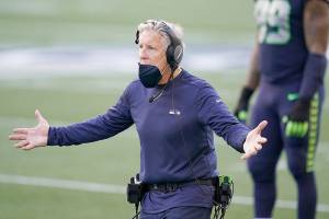 Seattle Seahawks head coach Pete Carroll reacts against the Dallas Cowboys during the second half of an NFL football game, Sunday, Sept. 27, 2020, in Seattle. (AP Photo/Elaine Thompson)