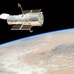 The Hubble Space Telescope drifts over Earth after its release in 2009 by the crew of the Space Shuttle Atlantis. The crew had performed all planned tasks during the fifth astronaut visit to the telescope. (NASA)
