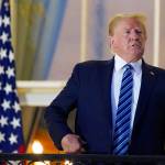 President Donald Trump returns to the White House Monday, Oct. 5, 2020, in Washington, after leaving Walter Reed National Military Medical Center, in Bethesda, Md. Trump announced he tested positive for COVID-19 on Oct. 2. (AP Photo/Alex Brandon)