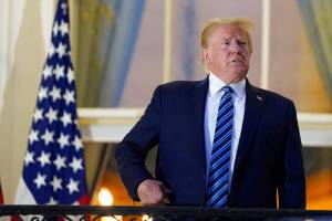President Donald Trump returns to the White House Monday, Oct. 5, 2020, in Washington, after leaving Walter Reed National Military Medical Center, in Bethesda, Md. Trump announced he tested positive for COVID-19 on Oct. 2. (AP Photo/Alex Brandon)