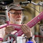 Don Sperlin works on a bike May 30, 2019 at Sharing Wheels Community Bike Shop in Everett. The nonprofit is organizing weekly volunteer work parties Tuesday and Thursday to fix childrens bikes through Dec. 10. (Kevin Clark / Herald file)