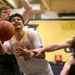 Mariner's Henry Avra is fouled by Glacier Peak’s Brayden Quantrille while going for a basket. Mariner lost to Glacier Peak 90-87 in double overtime in a boys' basketball game on Tuesday, Feb. 11, 2020 in Everett, Wash. (Andy Bronson / The Herald)