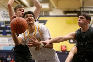 Mariner's Henry Avra is fouled by Glacier Peak’s Brayden Quantrille while going for a basket. Mariner lost to Glacier Peak 90-87 in double overtime in a boys' basketball game on Tuesday, Feb. 11, 2020 in Everett, Wash. (Andy Bronson / The Herald)