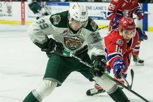 Everett Silvertips' Gage Gonclaves fights with Spokane Chiefs' Filip Kral for the puck during the game on Sunday, Jan. 26, 2020 in Everett, Wash. (Olivia Vanni / The Herald)