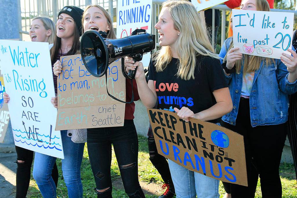 Oak Harbor High School student Ella Langrock, 17, leads a chant Friday afternoon during a climate protest in Coupeville during a global climate change protest in Sept. 2019. To Langrocks right are Tara Sullivan, Gracie Hiteshew and Hannah Rogers. (Laura Guido /Whidbey News-Times, file)